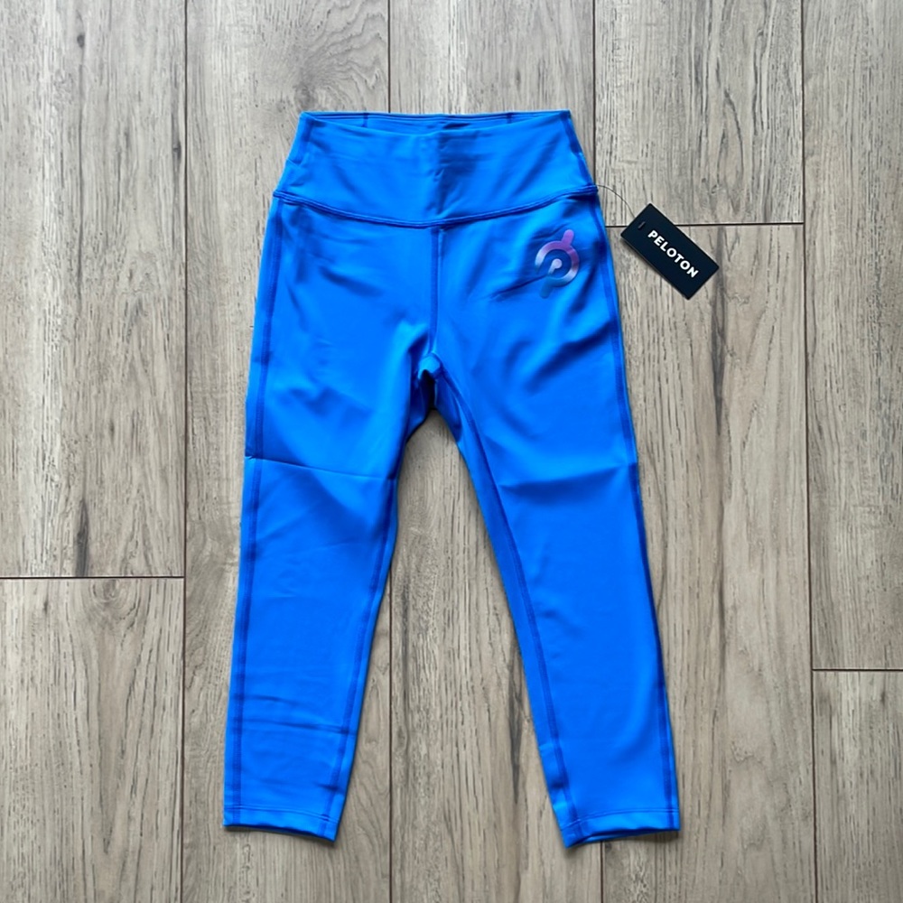 NWT Peloton Light Blue with Purple Logo Capri Leggings Women’s Size Small